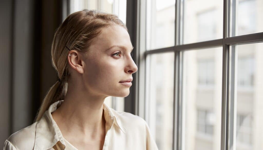 Woman looking out the window