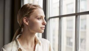 Woman looking out the window