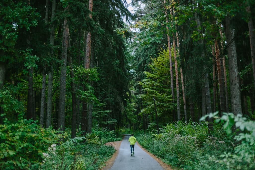 Man running in forest